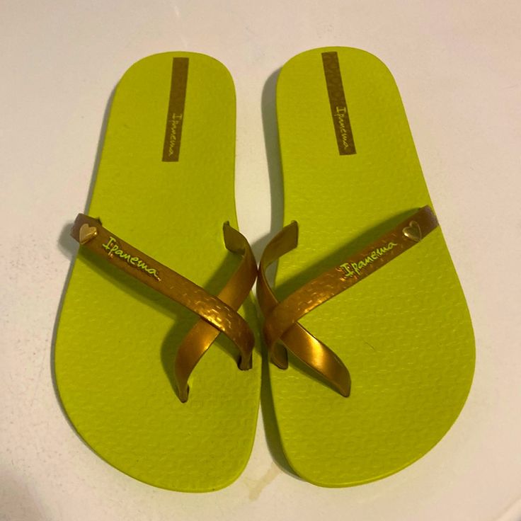 Ladies Sandals. Size 8/9. New, Never Worn, No Tags. Very Comfy, Flexible. Copperish Color Band With Lime Green Soles. Gold Flat Casual Flip Flops, Casual Gold Flip Flops For Spring, Yellow Cushioned Flip Flops For The Beach, Gold Cushioned Flip Flops For Vacation, Casual Gold Flip Flops For Beach Season, Gold Flip Flops For Beach In Spring, Gold Synthetic Summer Flip Flops, Casual Gold Flip Flops For Beach, Gold Jelly Sandals For Summer Beach