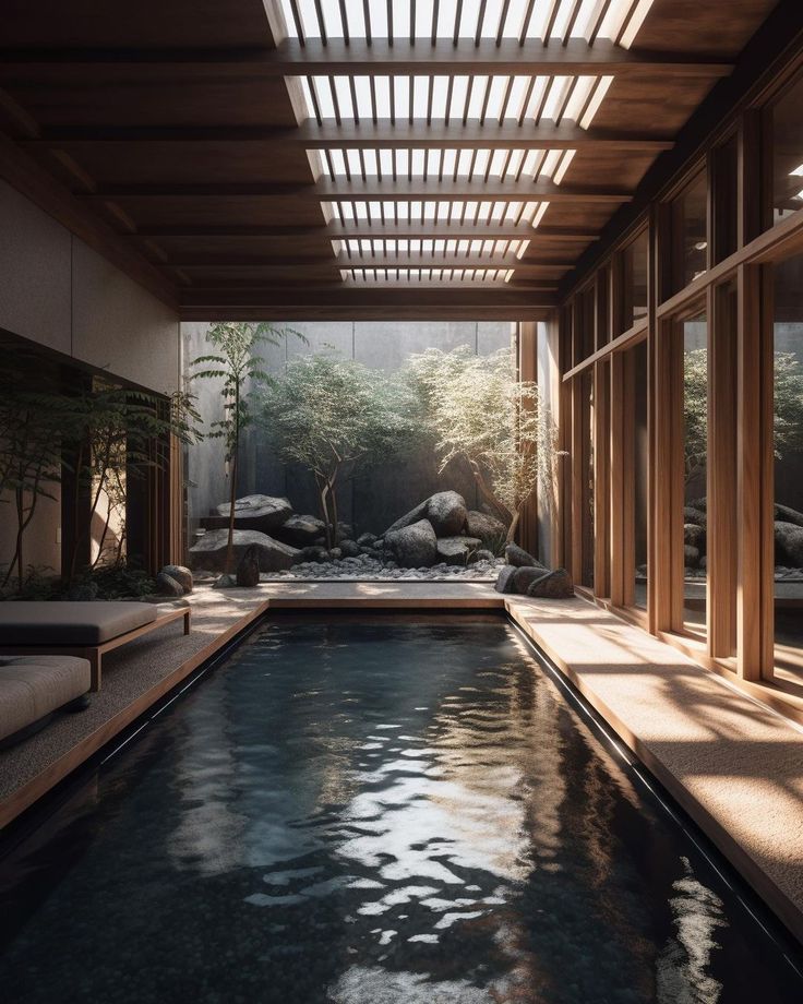 an indoor swimming pool in the middle of a room