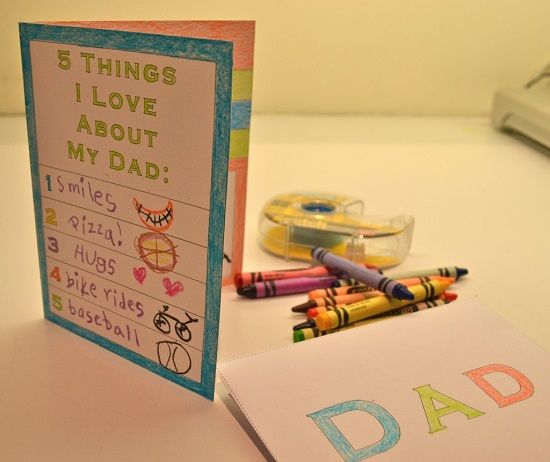 a father's day card next to some crayons