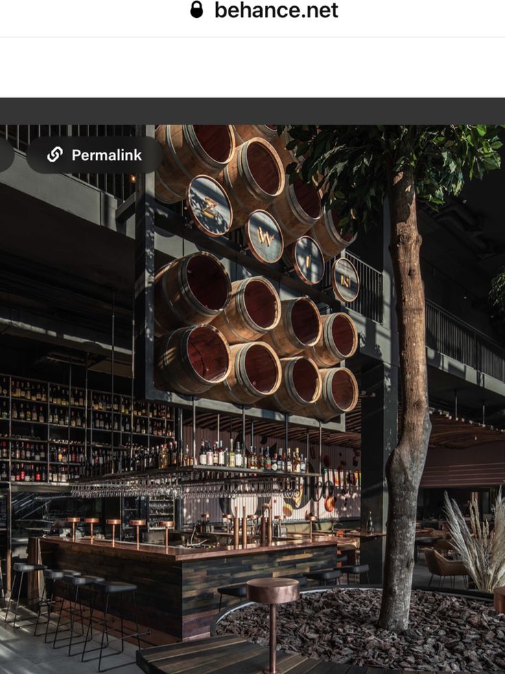 an image of a bar with lots of barrels hanging from the ceiling