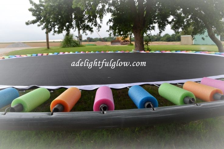 an inflatable trampoline with colorful tubes on it