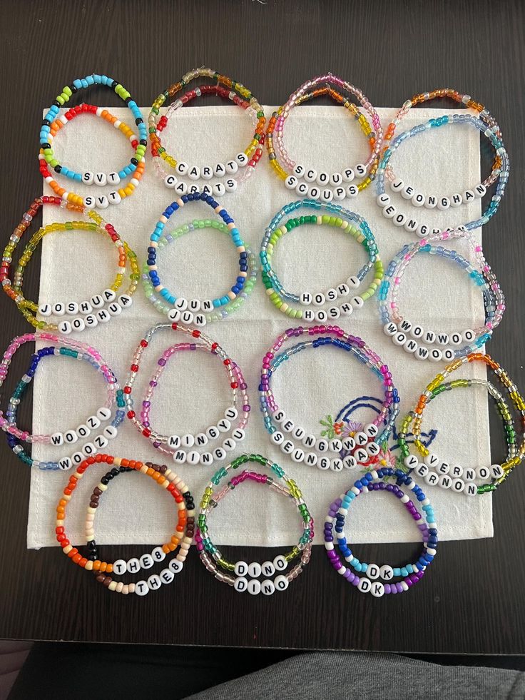 a bunch of bracelets sitting on top of a white napkin next to each other