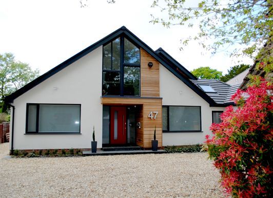 the front and side of a modern house