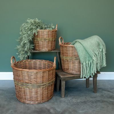 three wicker baskets sitting next to each other