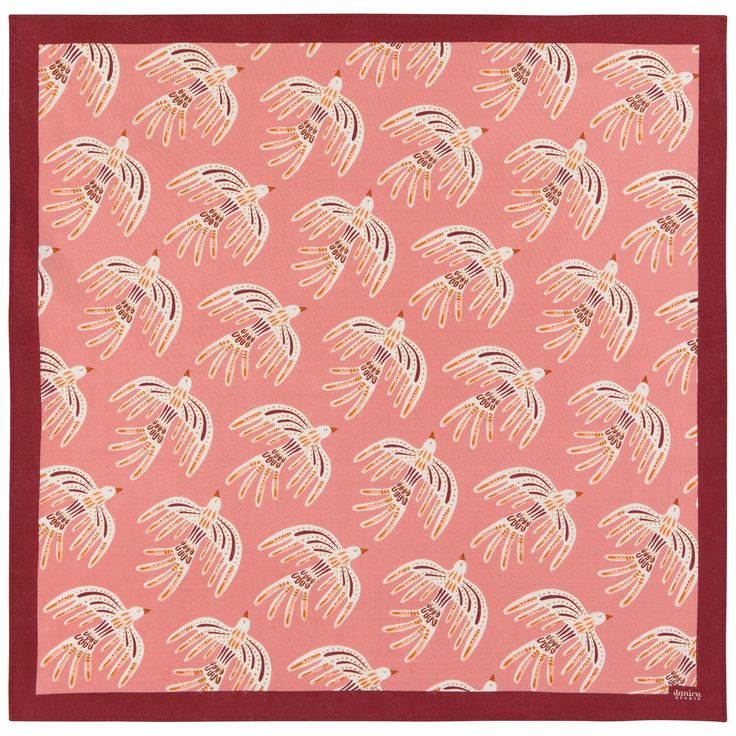 a pink and red square scarf with an abstract design on the front, featuring small white birds