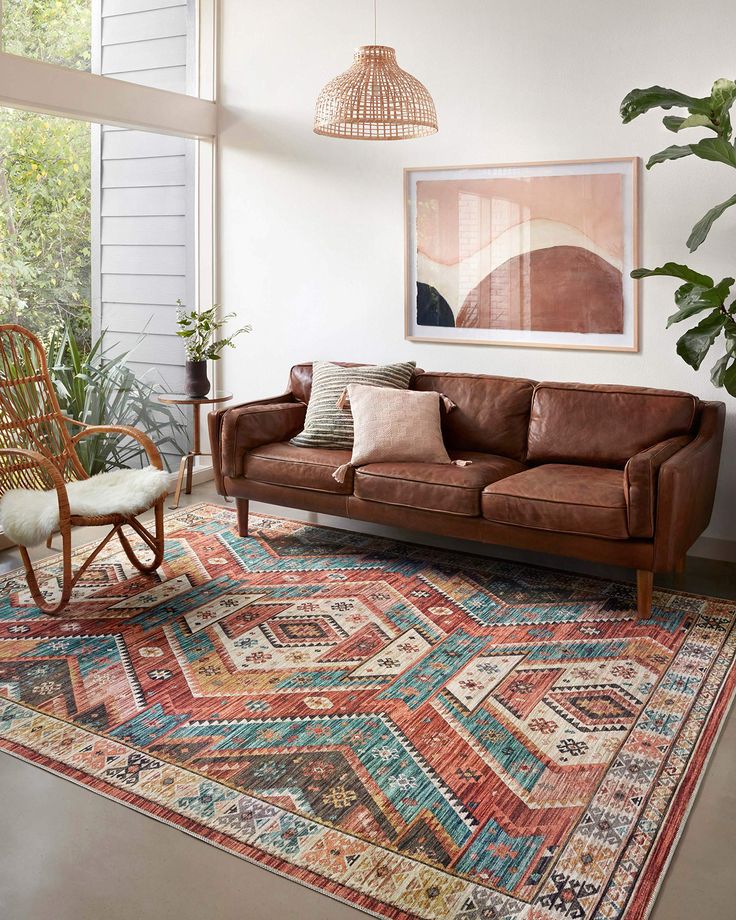 a living room filled with furniture and a rug