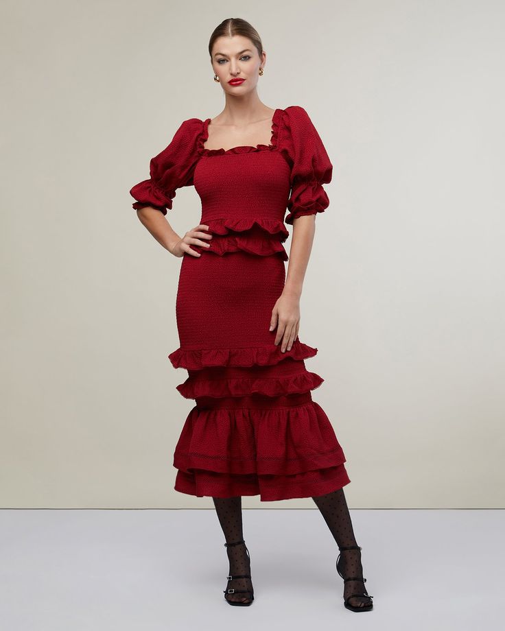 Romantic embellishments are at the heart of this jacquard dress. Smocked all over to create a body-hugging fit, it features ruffles along the square neckline and the puff sleeves, while several more, edged with picot, detail the waist and long, fluttery skirt. Lattice lace trim encircles the tiered hemline. Neckline ruffle Puff sleeve with ruffle Fully smocked body Two waistline ruffles with picot trim Two ruffles at skirt with picot trim 2 skirt bottom tiers with inset ladder lace trim 96% Poly Party Midi Dress With Square Neck And Ruffle Hem, Evening Midi Dress With Ruffles And Square Neck, Fitted Midi Puff Sleeve Dress With Ruffles, Fitted Puff Sleeve Midi Dress With Ruffles, Fitted Midi-length Puff Sleeve Dress With Ruffles, Fitted Tiered Puff Sleeve Dress With Ruffles, Fitted Tiered Smocked Dress With Ruched Detail, Fitted Ruched Tiered Smocked Dress, Fitted Smocked Midi Dress With Ruffle Hem