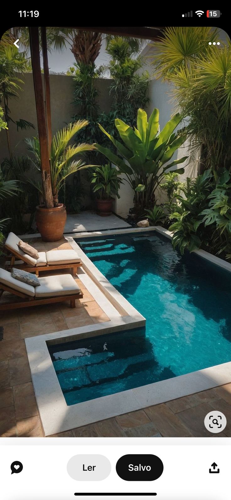 the pool is surrounded by tropical trees and plants