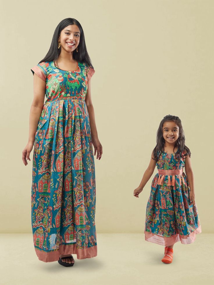 Blue Kalankari Print Mom and Daughter Matching Dresses | Muvvas Boutique | Mother Daughter Dress Matching Bollywood Style Blue Floral Print Dress, Bollywood Blue Floral Print Dress, Blue Bollywood Dress With Floral Print, Blue Bollywood Sets With Floral Print, Multicolor Block Print Dress For Eid, Traditional Sleeveless Blue Kurta, Blue Anarkali Sleeveless Set, Blue Sleeveless Anarkali Set, Festive Sleeveless Dresses With Printed Motifs