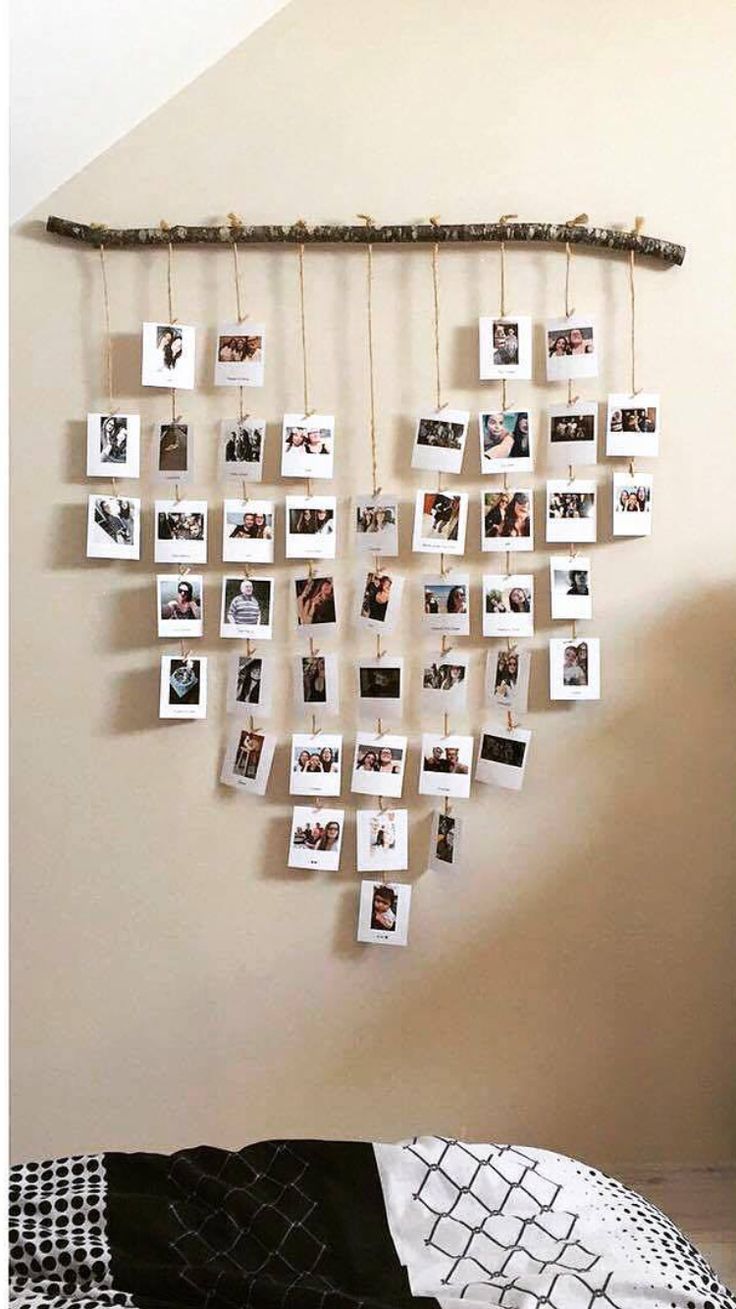 a bedroom with pictures hanging on the wall