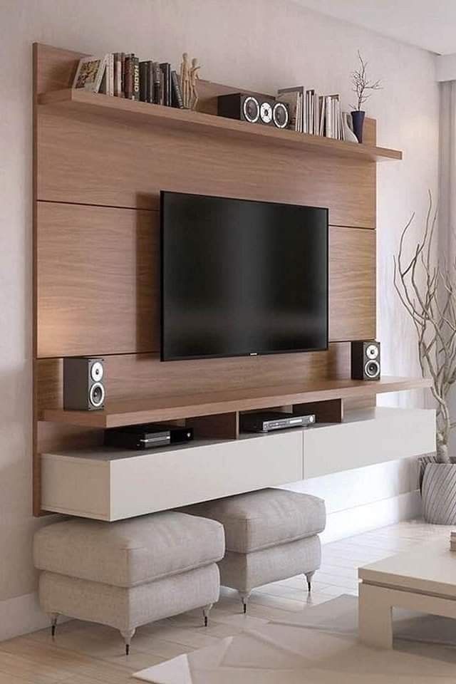 a living room with a flat screen tv on the wall