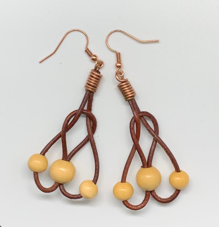 These lightweight fun earrings are approximately 2" long and 1" wide. Copper ear wires. Copper Components are Sealed with Protectaclear ProtectaClear is a clear, protective coating that is tough enough to protect jewelry and is safe for wear against skin. ProtectaClear is practically invisible once applied and will seal and protect jewelry from tarnish, oxidation, and corrosion Unique Wire Drop Earrings, Adjustable Dangle Chandelier Earrings, Copper Wire Drop Earrings With Matching Set, Adjustable Copper Wire Pierced Earrings, Adjustable Teardrop Wire Jewelry, Adjustable Wire Wrapped Brown Earrings, Adjustable Brown Wire Wrapped Earrings, Brown Wire Wrapped Dangle Earrings, Adjustable Teardrop Linear Earrings With Ear Wire