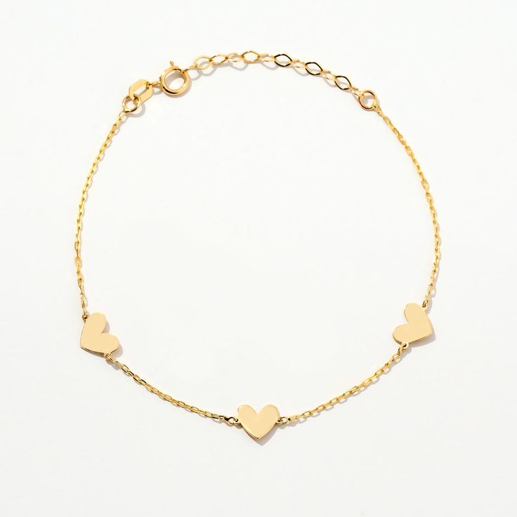 ❧ Product Overview and Key Features  Unique Heart Station Bracelet in 14K Solid Gold, a perfect blend of elegance and love. This bracelet features a series of delicate hearts, making it an ideal gift for anniversaries or just to express your affection. Crafted for women who appreciate timeless jewelry, this 14K gold charm bracelet adds a touch of sophistication to any outfit. A must-have for every jewelry collection. *Material & Color Options: 14k Yellow Gold *Length Options: 5", 5.5", 6", 6.5", Delicate Gold Bracelets For Valentine's Day, Delicate Gold Bracelet For Valentine's Day, Delicate Yellow Gold Heart Bracelet, Elegant 14k Gold Bracelets For Valentine's Day, Elegant Bracelets For Mother's Day Anniversary Gift, Elegant Open Heart Bracelets For Mother's Day, Delicate Yellow Gold Heart Bracelet For Anniversary, Classic Heart Jubilee Bracelet For Valentine's Day, Fine Jewelry Heart-shaped Bracelets For Anniversary