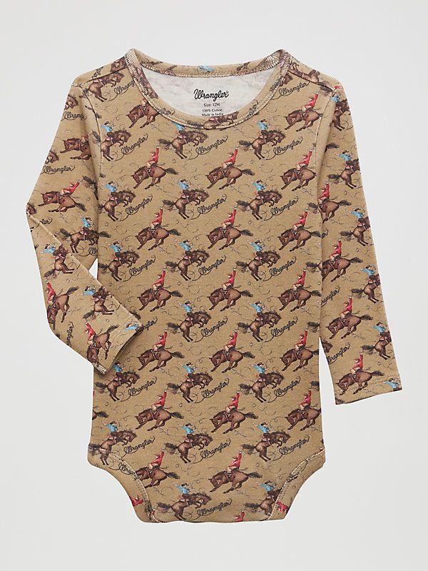 A TRUE WESTERN ICON Dress him in imagery straight from the heart of cowboy country with the Little Boy’s Wrangler® Western Print Bodysuit. Crafted from a premium 100% cotton blend with snaps to speed up diaper changes, this is the perfect bodysuit to introduce him to all the adventure that come with a Western lifestyle, without missing out on function. Icon Dress, Western Baby, Straight From The Heart, Western Lifestyle, Children Fashion, Iconic Dresses, Toddler Boy Outfits, Print Bodysuit