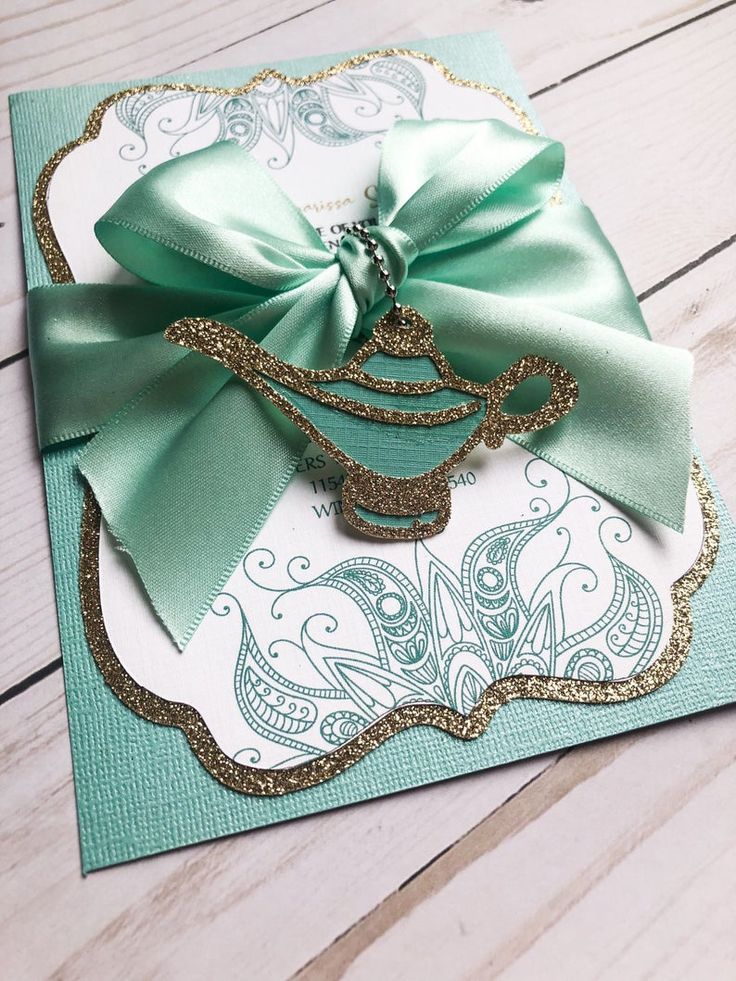 a close up of a card with a bow on it