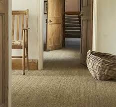 an open door leading to another room with stairs and chairs in it on carpeted flooring