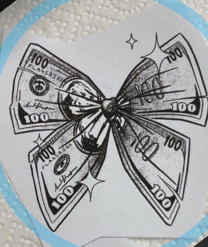 a paper bow with dollar bills on it