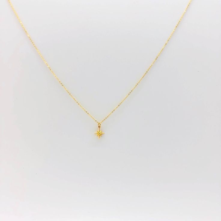 The Eight Point North Star Gold Necklace is our magic touch for your neckline. This jewelry piece adds a touch of sophistication to your look with your minimalist jewelry style. Crafted with a dainty, 14k gold filled chain and gold charm, this necklace is the perfect complement to any outfit, or any necklace layer. Crafted with precision, both chain and charm are gold filled yet light and comfortable for everyday wear. 14K gold filled chain 14k gold lobster clasp 18k vermeil gold star 16 & 18 in Star Gold Necklace, Star Necklace Gold, Jewelry Style, 14k Gold Necklace, North Star, Star Necklace, Gold Filled Chain, Gold Charm, Gold Stars