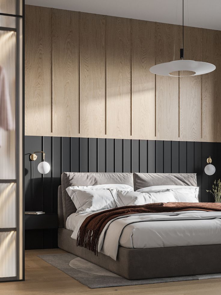 a large bed sitting next to a wooden wall