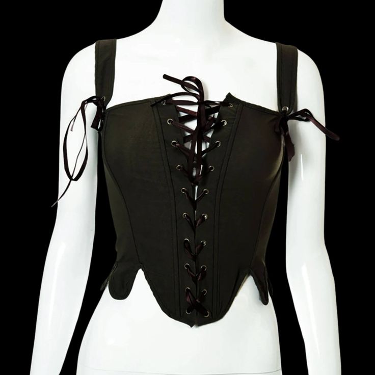 This corset embodies the fierce spirit and timeless elegance of these formidable warrior women. Embrace your inner shieldmaiden and command attention with every stride, as the corset's intricate lace-up design accentuates your curves with undeniable allure. Constructed with both style and functionality in mind, the Shieldmaiden Lace-up Corset offers unparalleled support and comfort, allowing you to conquer any battlefield – whether it be the halls of Valhalla or the bustling streets of modern-da Black Medieval Underbust Corset Belt, Black Steampunk Corset For Larp, Black Gothic Corset With Straps, Halloween Festival Corset, Fantasy Overbust Corset Belt For Larp, Gothic Corset Belt For Costume Party, Black Corset With Straps For Costume Party, Black Fitted Medieval Corset Belt, Black Steampunk Corset Belt For Larp