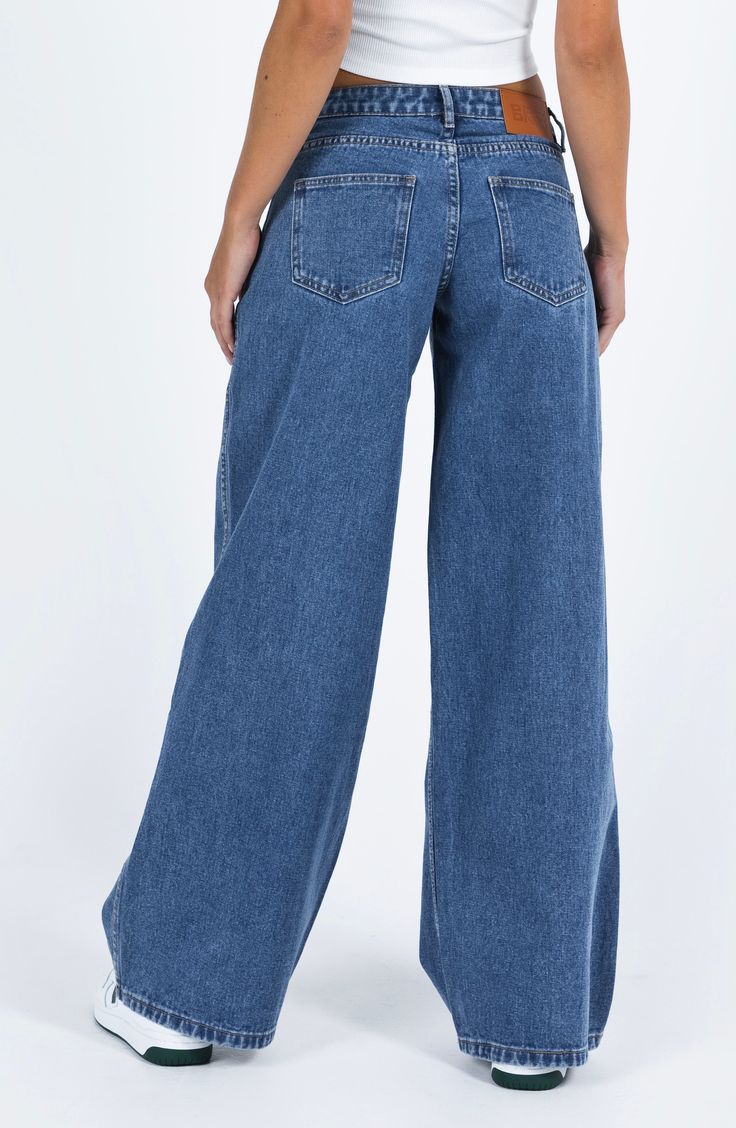 Flaunt vintage vibes in these medium-wash nonstretch jeans featuring a low-rise waist and full-length wide legs. 31 1/2" inseam; 26" leg opening; 10 1/2" front rise; 14" back rise (size 8) Zip fly with button closure Five-pocket style 70% cotton, 15% viscose, 15% polyester Machine wash, line dry Imported Wide Jeans Outfit High Waist, Medium Wash Jeans Outfit, Winter Drama, Baggy Jeans Aesthetic, Low Waisted Jeans Outfit, Wide Jeans Outfit, Wash Jeans Outfit, Vintage Wide Leg Jeans, Low Rise Wide Leg Jeans