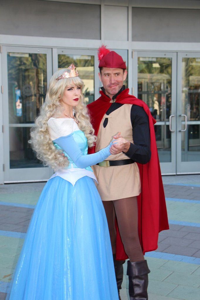 a man and woman dressed up in costumes