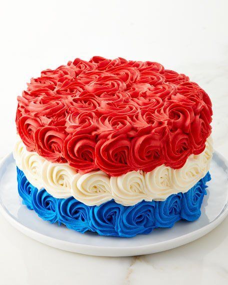 a cake with red, white and blue frosting on it sitting on a plate