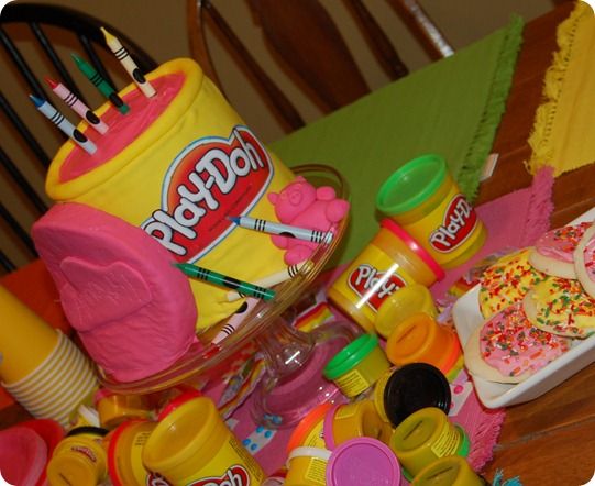 a table topped with lots of toys and condiments