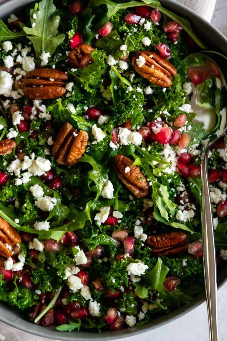 a salad with pecans, feta cheese and pomegranate