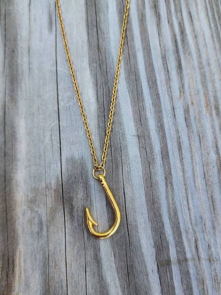 "Fish hook necklace!  Hook is gold plated and measures 26x16mm. It is on an 18\" gold plated stainless steel chain.  *can replace chain with longer 24\" chain if requested when ordered *each additional item ships for only $1" Adjustable Gold Jewelry With Fish Hook, Brass Jewelry With Fish Hook For Gift, Indian Rocks Beach, Fish Hook Necklace, Hook Necklace, Star Bracelet, Fish Hook, Stainless Steel Chain, Charm Necklace