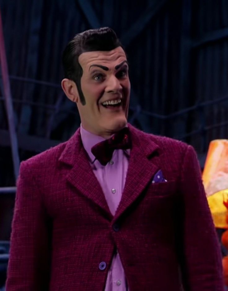 a man in a purple suit and bow tie