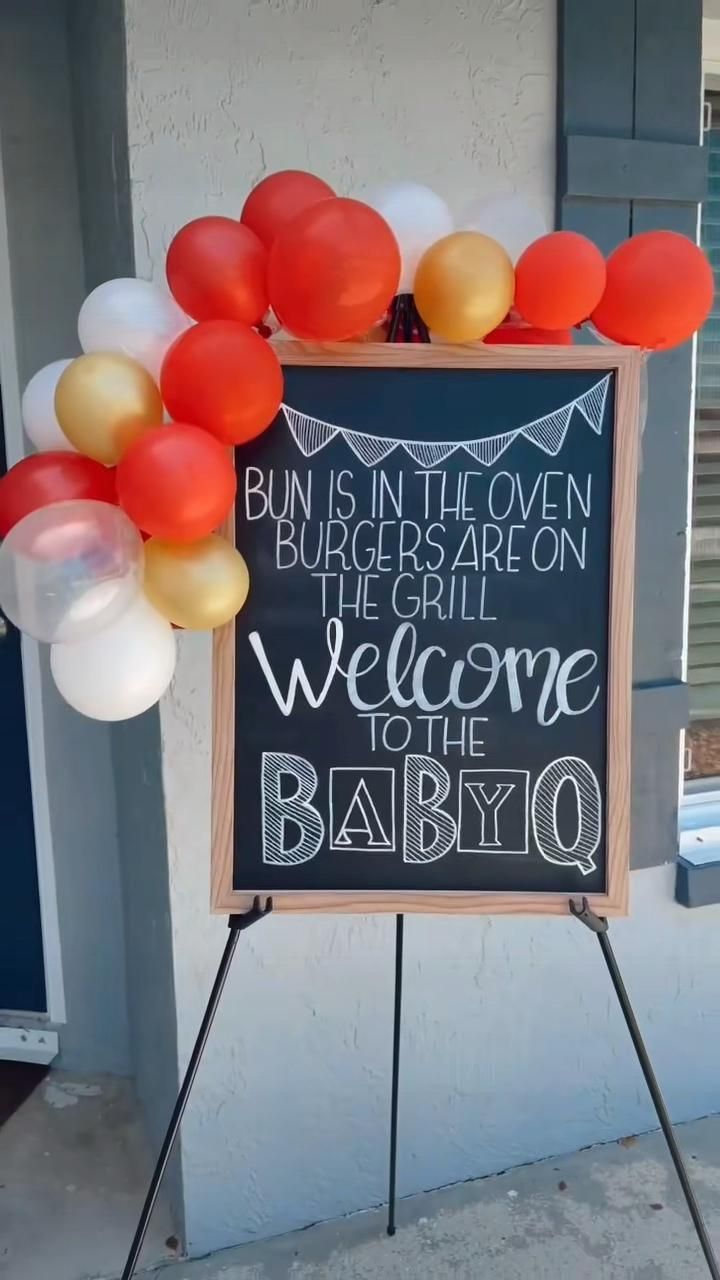 a sign that says bun is in the oven, burgers are on the grill, welcome to the babyo