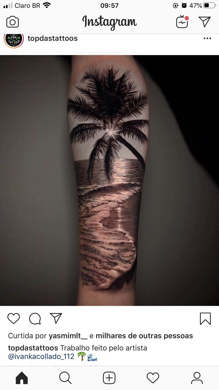 a person with a tattoo on their arm that has a palm tree in the middle