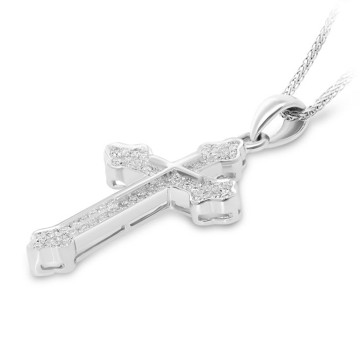 18K White Gold Gothic Style Budded Edge Diamond Adorned Cross Pendant
Celebrate your faith with this beautiful diamond cross pendant. Fashioned in 18K white gold, this Gothic-style design features a cross shape with pointed budded edges - all adorned with shimmering diamonds. Radiant with 0.40 ct. t.w. of diamonds and a bright polished shine, this pendant is the perfect gift for your loved one. 
0.40 carat 
18k white gold
We offer a Free virtual Consultation from the comfort of yo White Diamond Cross Pendant Necklace, Luxury Diamond White Cross Pendant Necklace, Luxury Diamond White Cross Necklace, Luxury White Gold Cross Necklace With Diamond Accents, Diamond White Cross Necklace Fine Jewelry, White Gold Crucifix Necklace With Vvs Clarity, Luxury Silver Cross Necklace With Diamond Accents, White Crucifix Cross Necklace With Brilliant Cut, White Cross Necklace With Diamond Accents