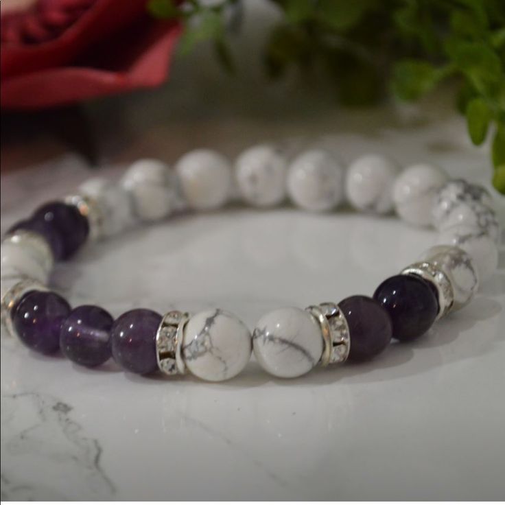 All Natural Gemstones And Handmade By Me! Amethyst And Howlite Stretchy Bracelet Amethyst Alleviates Negative Energies And Activates Spiritual Awareness And Intuition. Howlite Is A Calming Stone That Aids With Emotional Expression, Communication, And Awareness. Howlite Strengthens Memory And Our Desire For Knowledge Adjustable White Crystal Bracelet With Gemstone Beads, Adjustable White Crystal Bracelet With Natural Stones, White Gemstone Beads Bracelet As Gift, Bohemian White Crystal Bracelet With Natural Stones, White Healing Jewelry With Natural Stones, White Crystal Bracelet With Gemstone Beads As Gift, White Spiritual Stretch Bracelet With Gemstone Beads, Spiritual White Gemstone Beads Stretch Bracelet, Adjustable White Gemstone Jewelry