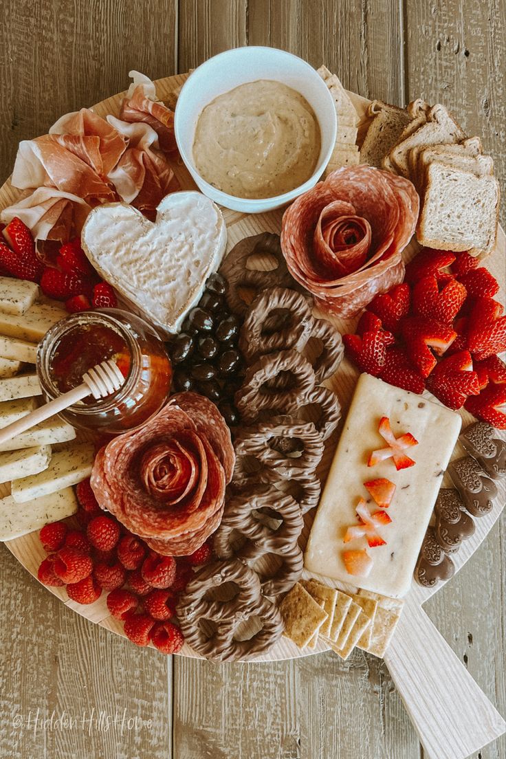 Valentine’s Day inspired charcuterie board with heart shaped fruit, cheese, chocolate, and snacks! Valentines Themed Charcuterie Board, Valentines Party Charcuterie Board, Simple Valentines Charcuterie Board, Board Party Ideas Valentines, Galantines Day Food Ideas, Charcuterie Valentines Board, V Day Charcuterie Board, Charcuterie Board Themes Valentines, Galentines Party Charcuterie Board