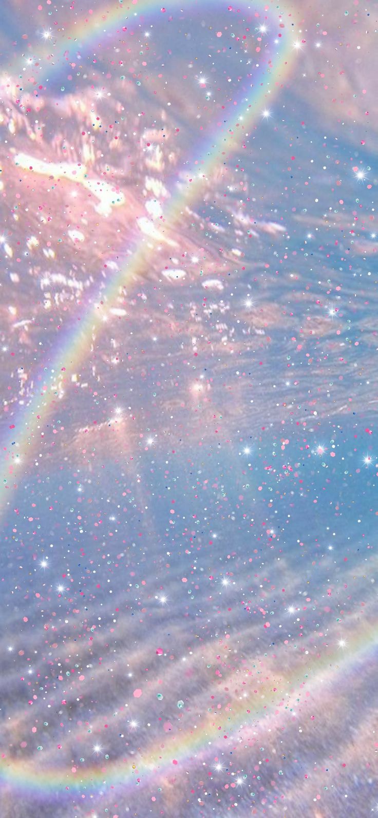 two rainbows in the sky above water with bubbles and stars around them, forming a heart shape