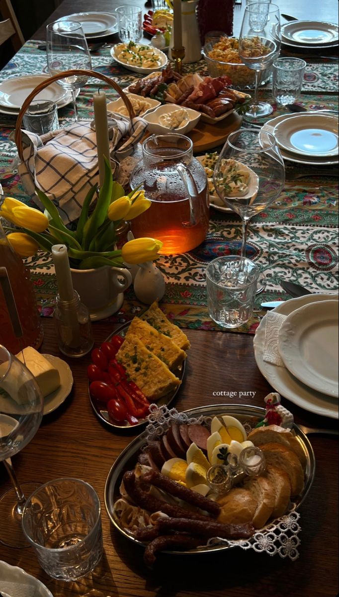 a table is set with food and glasses