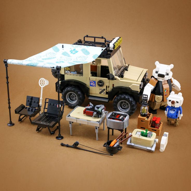 an assortment of toys including a jeep and camper