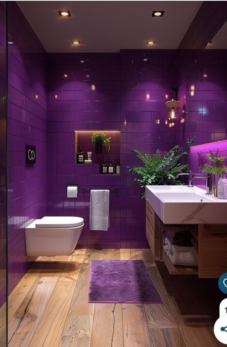 a bathroom with purple walls and wooden floors