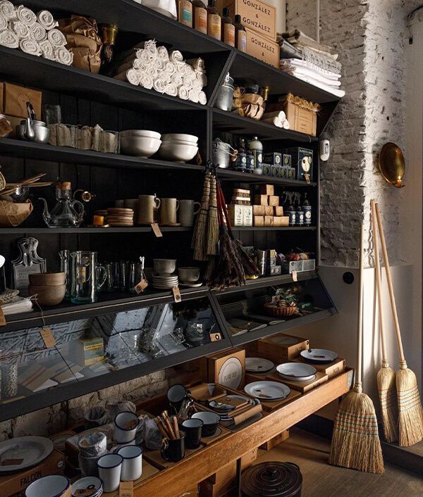 the shelves are filled with dishes and other items