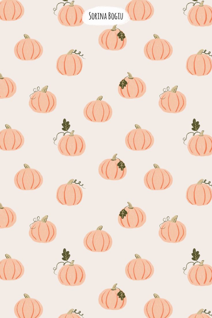 an orange pumpkin pattern is shown on a light pink background with green leaves and dots