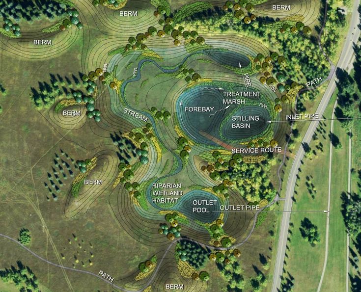 an aerial view of a golf course in the woods