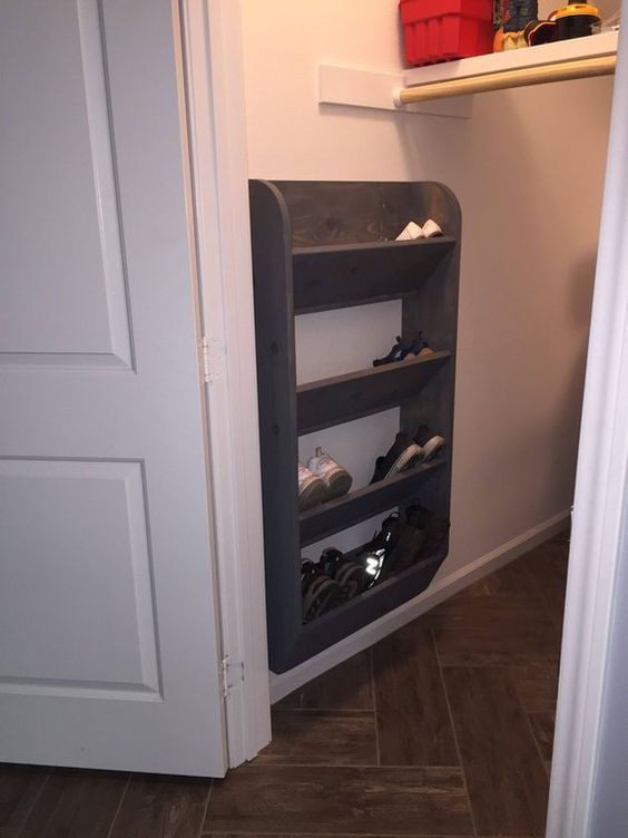 there is a shoe rack in the closet