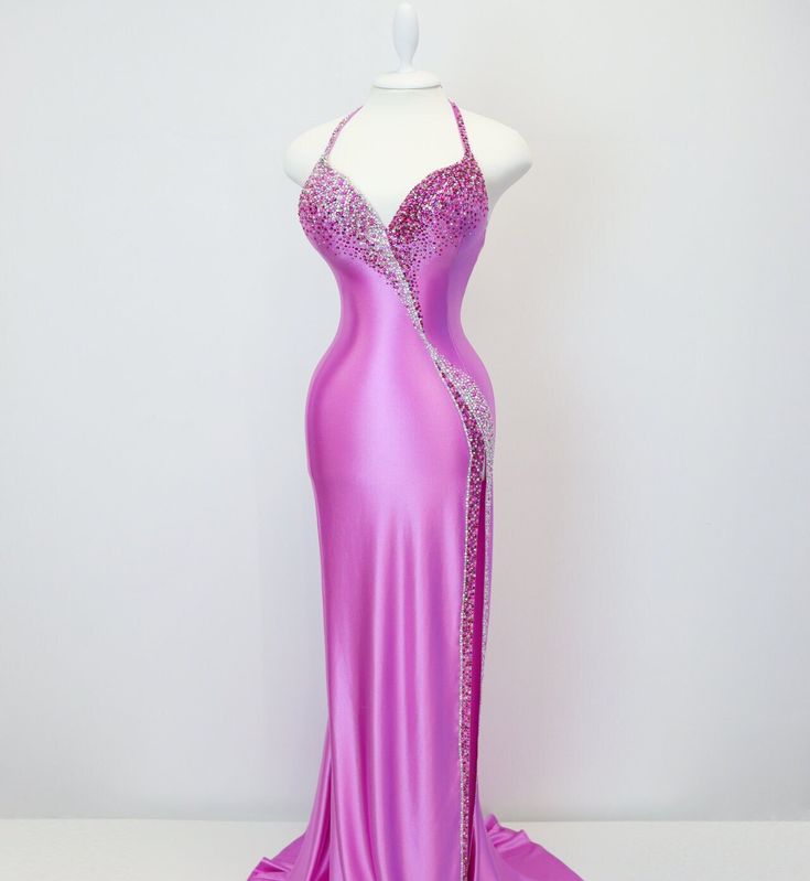 a pink evening gown on a mannequin with sequins in the back