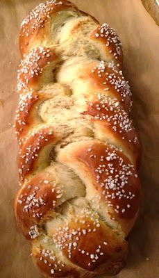 a loaf of bread sitting on top of a piece of wax paper