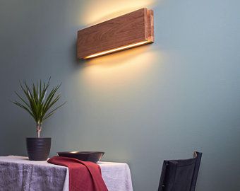 a table with a white cloth on it next to a potted plant