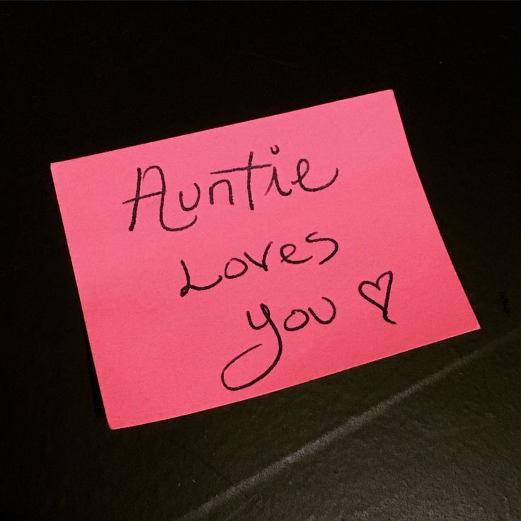 a piece of pink paper with the words'auntie loves you'written on it