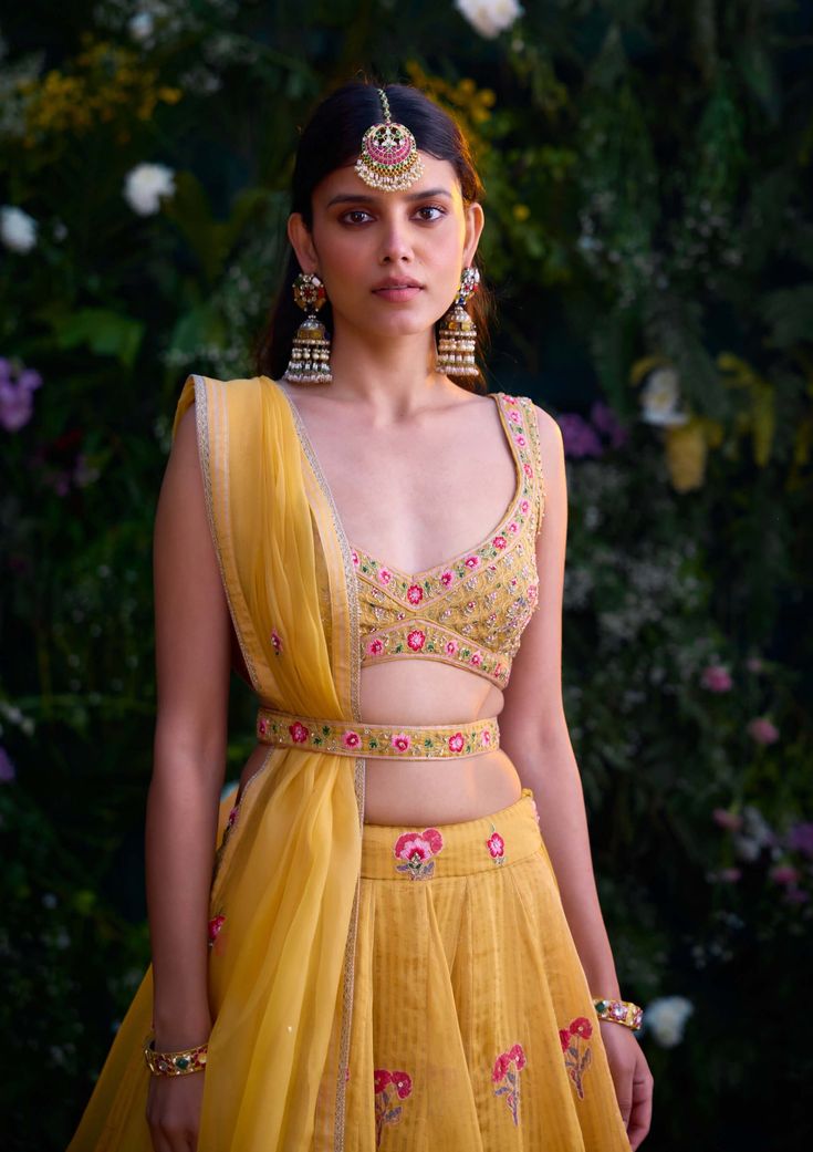 Illuminate the occasion in this spectra yellow block printed lehenga, elevated with exquisite zardozi embroidery. Paired gracefully with an organza dupatta, this ensemble exudes elegance and charm. Crafted with meticulous attention to detail, it's the perfect choice for those seeking to make a radiant statement at any special occasion. Yellow Palazzo Set With Zari Work For Reception, Yellow Palazzo Set With Dupatta For Reception, Yellow Palazzo Set For Diwali Reception, Yellow Palazzo Set For Reception Diwali, Yellow Palazzo Set For Reception During Diwali, Yellow Chanderi Sets For Reception, Yellow Palazzo Set For Reception And Navratri, Ridhi Mehra, Payal Singhal