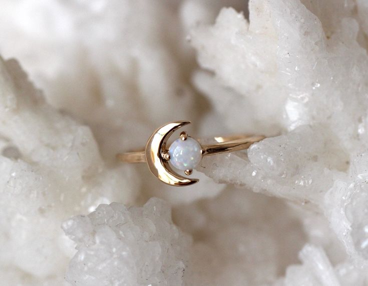 "We love this ring to the moon and back! Our 14K \"Moon of My Life\" ring is available in your choice of yellow, white or rose gold and features a dreamy crescent moon emphasized by a lovely Birthstone of your choice. One of our most popular rings! - Gemstone Measures 4mm across - Available in 14K rose, yellow or white gold - Round Band measure 1.3mm - Moon measures 8.5 mm in length Stone options- 1. Rhodolite Garnet (January- Rose Cut) 2. Amethyst (February- Rose Cut) 3. Aquamarine (March- Smoo 14k Gold Opal Ring, Moon Of My Life, Ring Moon, Life Ring, Rings Gemstone, Popular Rings, Ring Birthstone, Moon Ring, Rhodolite Garnet